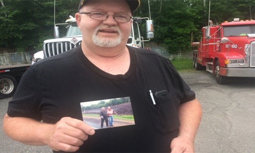 LLoyd Munn, a retired tow truck operator holds up a photo of himself and Bob Dewitt. Last month, after a long fight with Leukemia, Bob Dewitt passed away. Owner of Bob’s towing, Dewitt had made a name for himself in the Fredericton towing community. A much loved friend and a coach, Dewitt spent many years of his life teaching and grooming other operators.